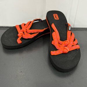 Teva orange and black flip flops Size 8